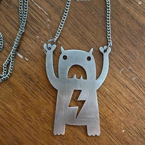 Laser Cut Hanging Tiny Monster Metal Necklace